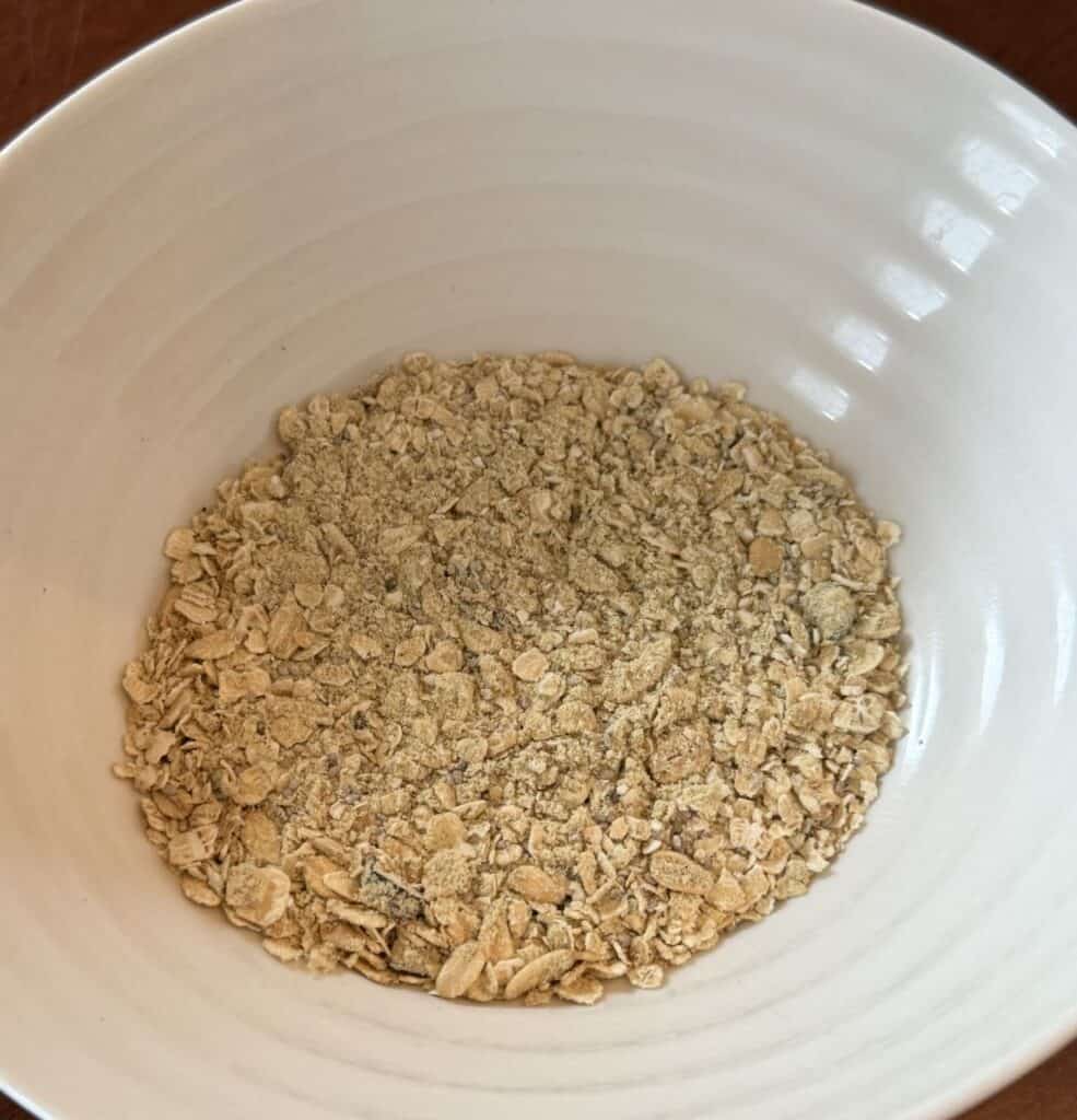 Top down image of a bowl of the overnight oats, dry, before being prepared.