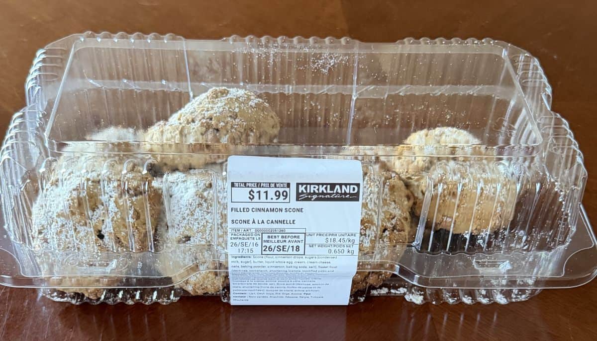 Image of the Costco Kirkland Signature Filled Cinnamon Scones container sitting on a table unopened.