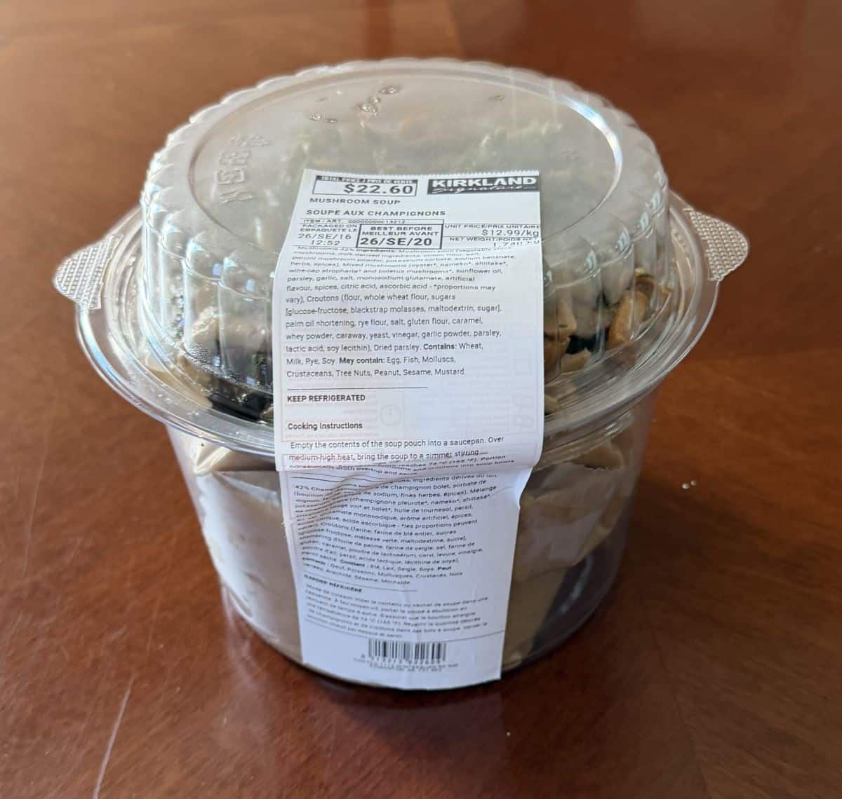 Image of the Costco Kirkland Signature Mushroom Soup sitting on a table unopened.