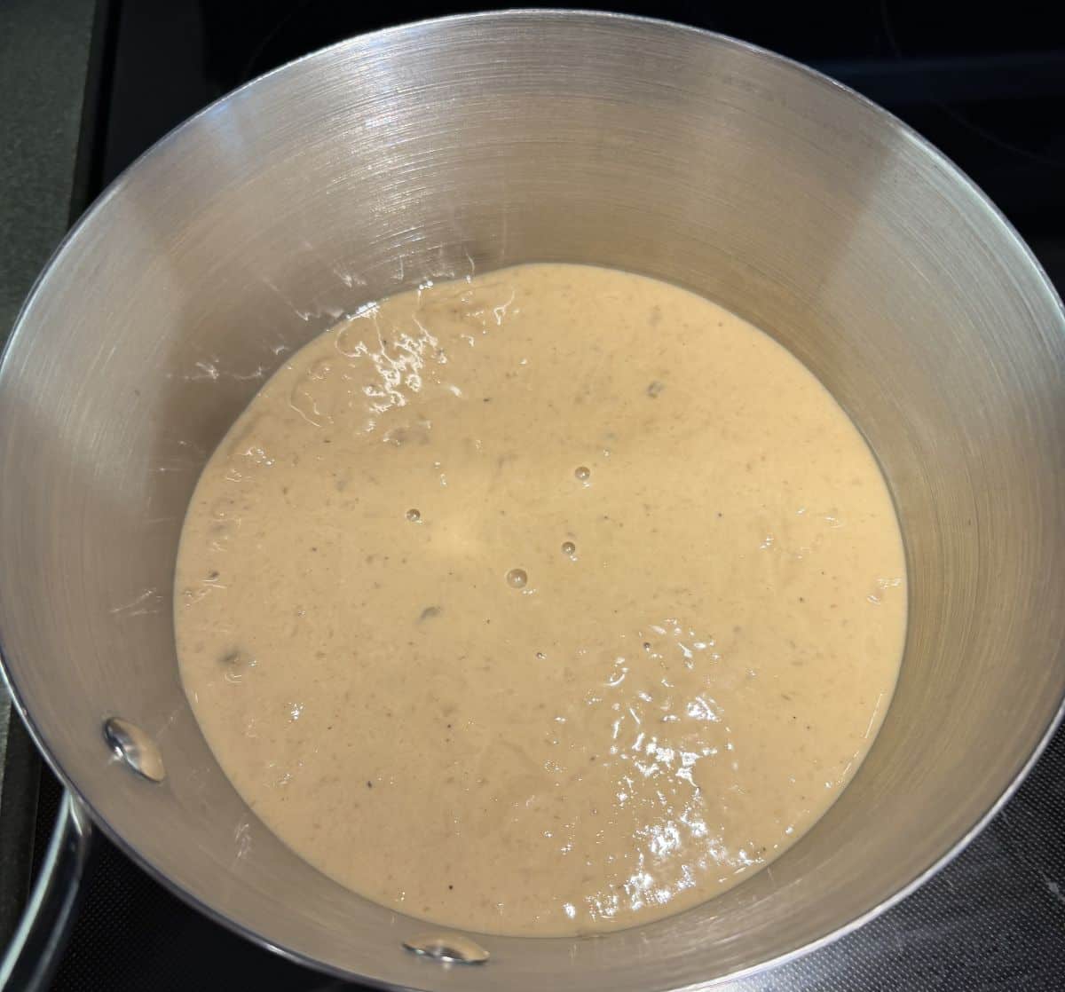 Top down image of the soup being heated in a pot on the stove.