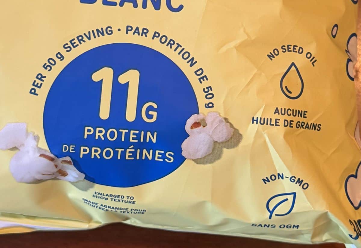 Image of the bag showing that there is no seed oil, the popcorn is Non-GMO and has 11 grams of protein per serving.