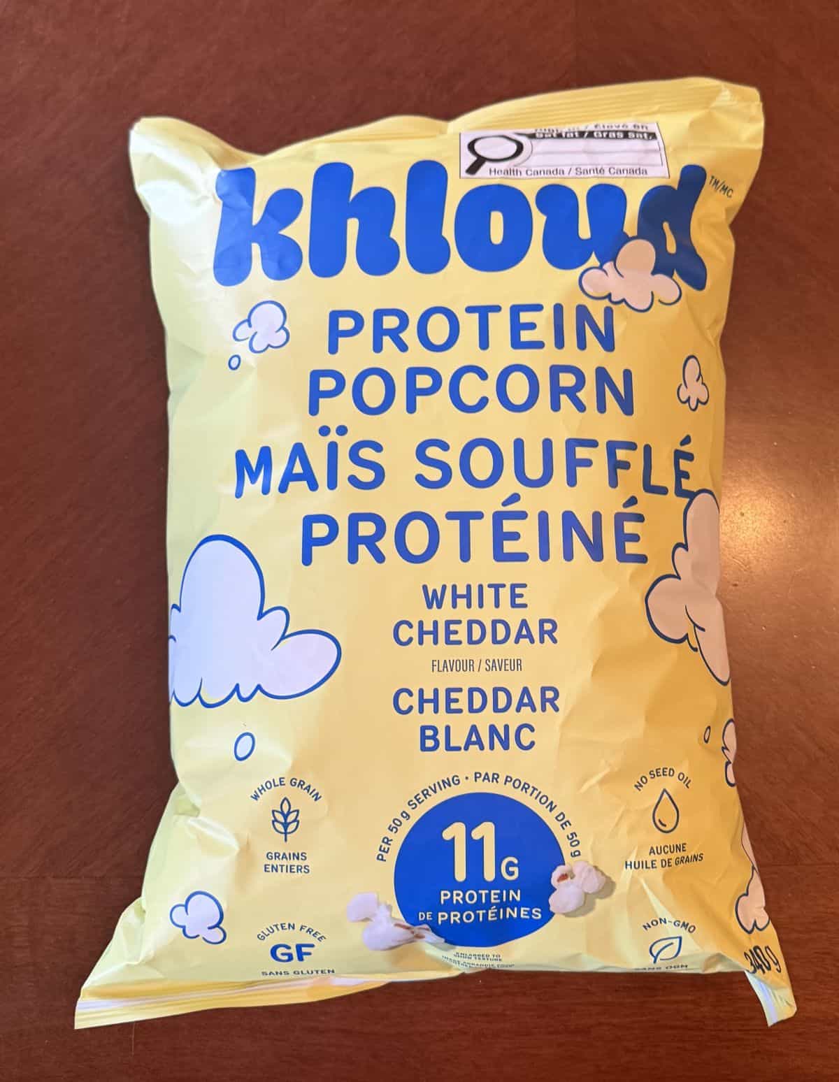 Image of the Costco Khloud Protein Popcorn bag sitting on a table unopened.